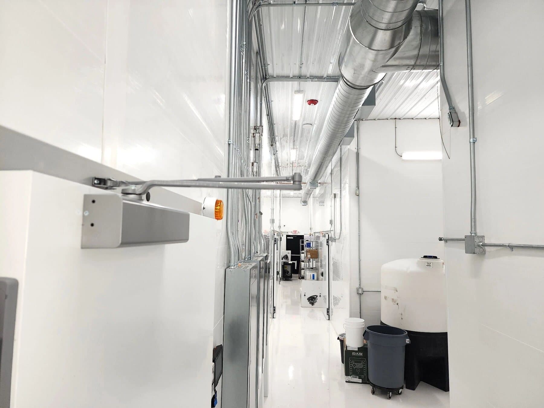 Commercial interior with exposed ductwork and mechanical rough-in
