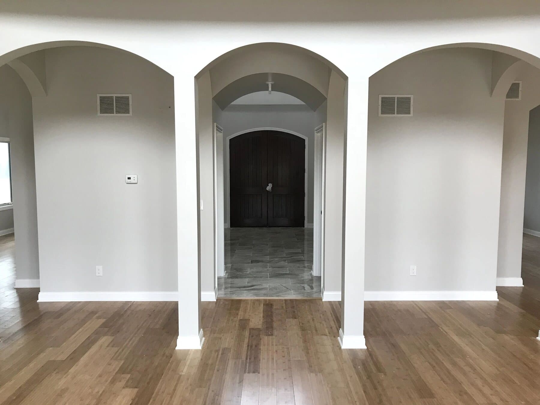 Interior archway detail framing a hallway in a custom home