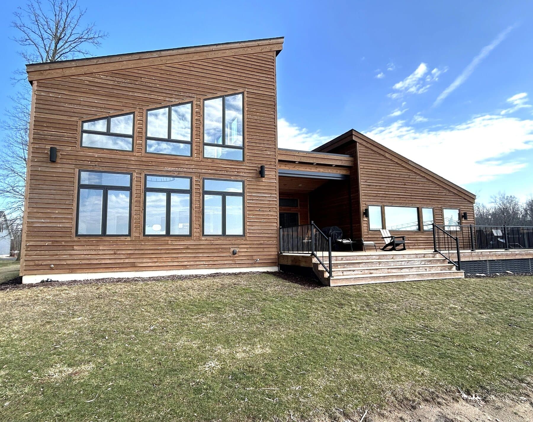 Modern cedar-clad home with floor-to-ceiling windows